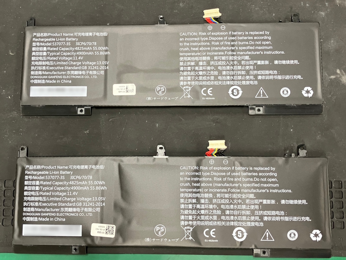 新品のバッテリーと膨張したバッテリー