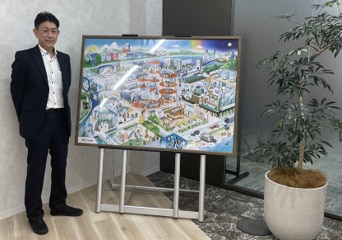 近未来的な町の様子を描いた絵画の横に立つ青野様